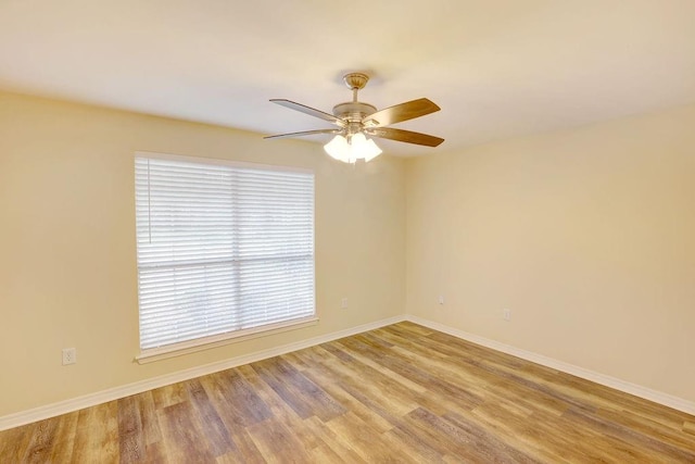 spare room with ceiling fan and light hardwood / wood-style floors