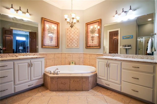 bathroom featuring tiled tub, tile patterned floors, a notable chandelier, and crown molding