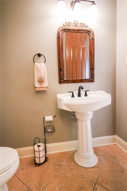 bathroom with tile patterned floors and toilet