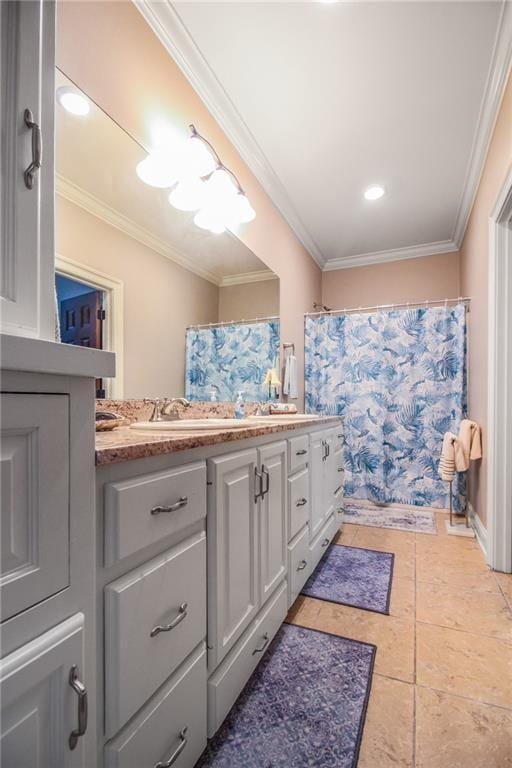 bathroom featuring tile patterned flooring, vanity, and crown molding