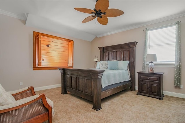 carpeted bedroom featuring ornamental molding and ceiling fan