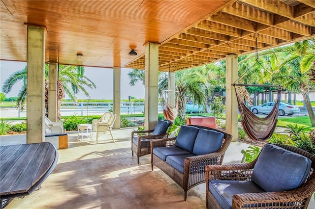 view of patio / terrace with outdoor lounge area and a water view