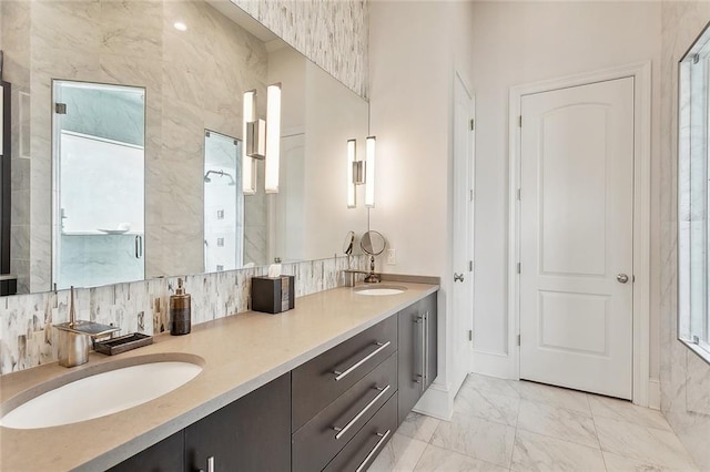 bathroom featuring dual vanity, tasteful backsplash, a wealth of natural light, and tile patterned flooring