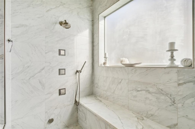 bathroom featuring tiled shower