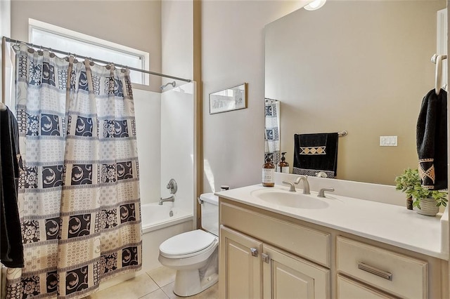 full bathroom with shower / bath combo, tile patterned floors, vanity, and toilet