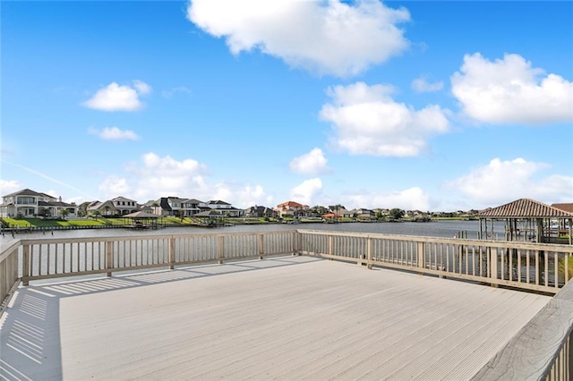 wooden terrace featuring a gazebo