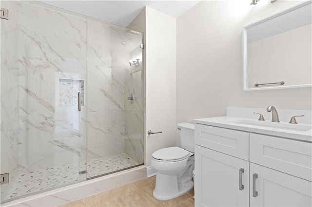 bathroom featuring tile patterned floors, walk in shower, vanity, and toilet