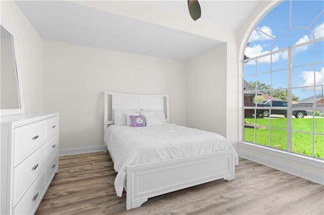 bedroom featuring ceiling fan and light wood-type flooring