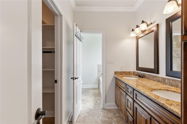 bathroom featuring vanity and ornamental molding