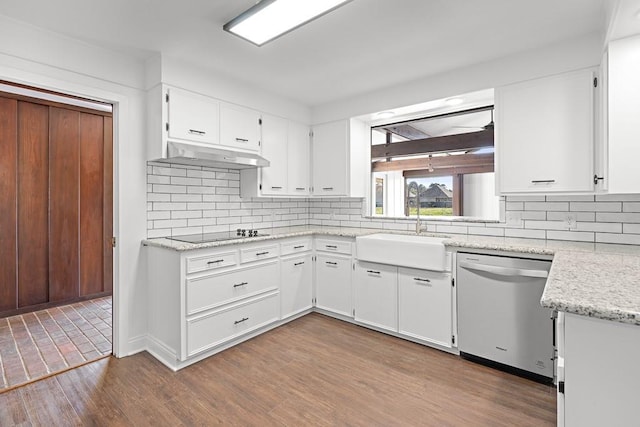 kitchen with black electric stovetop, backsplash, stainless steel dishwasher, white cabinets, and hardwood / wood-style floors