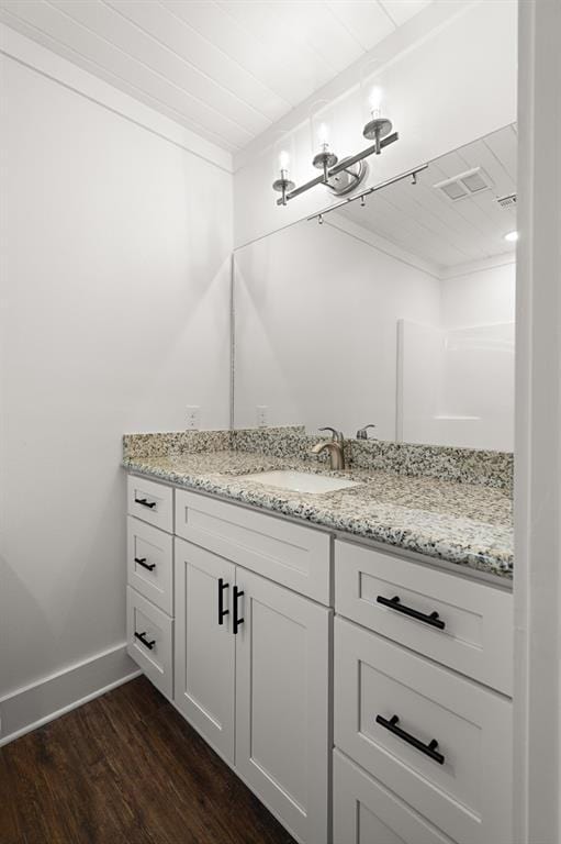 bathroom featuring vanity and hardwood / wood-style flooring