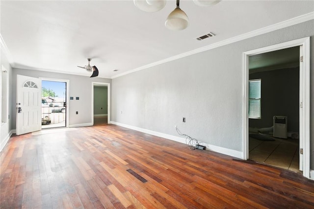 unfurnished room with hardwood / wood-style flooring, crown molding, and ceiling fan