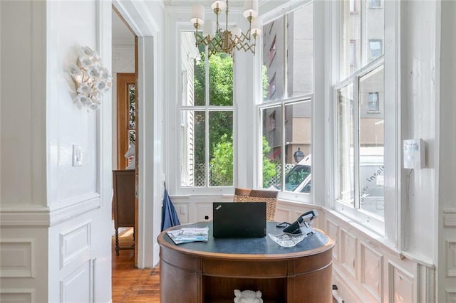 sunroom with a chandelier