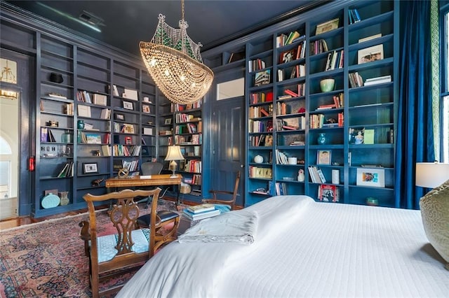 bedroom with a notable chandelier