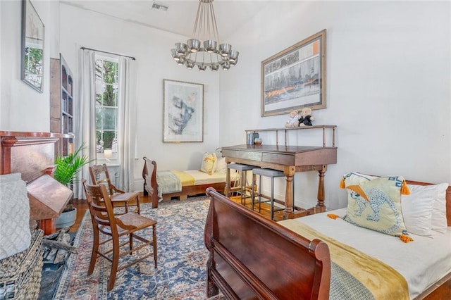 living area featuring visible vents and an inviting chandelier