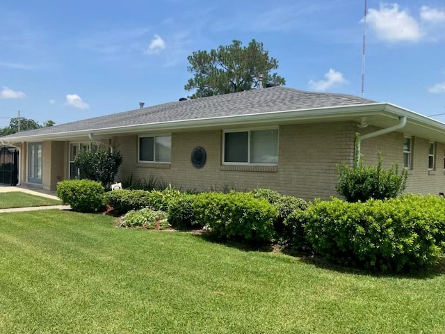 view of home's exterior with a lawn