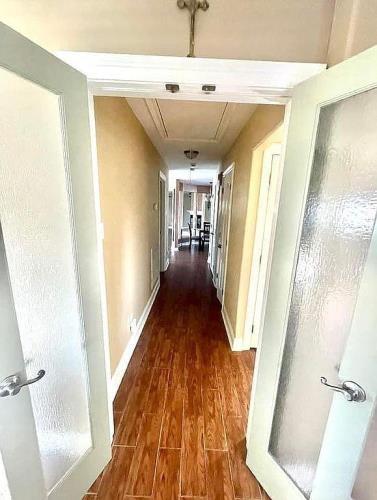 hallway with dark hardwood / wood-style floors