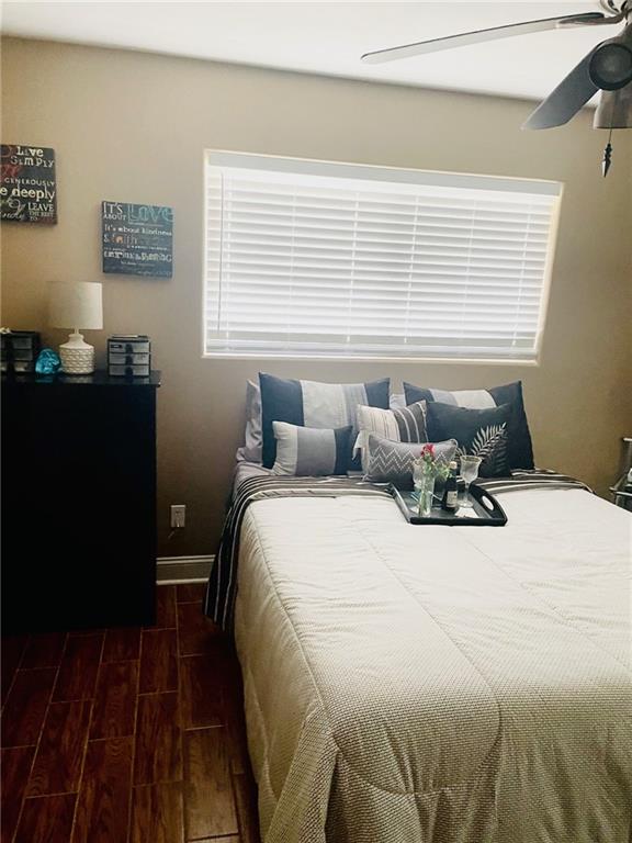 bedroom with ceiling fan and light hardwood / wood-style floors