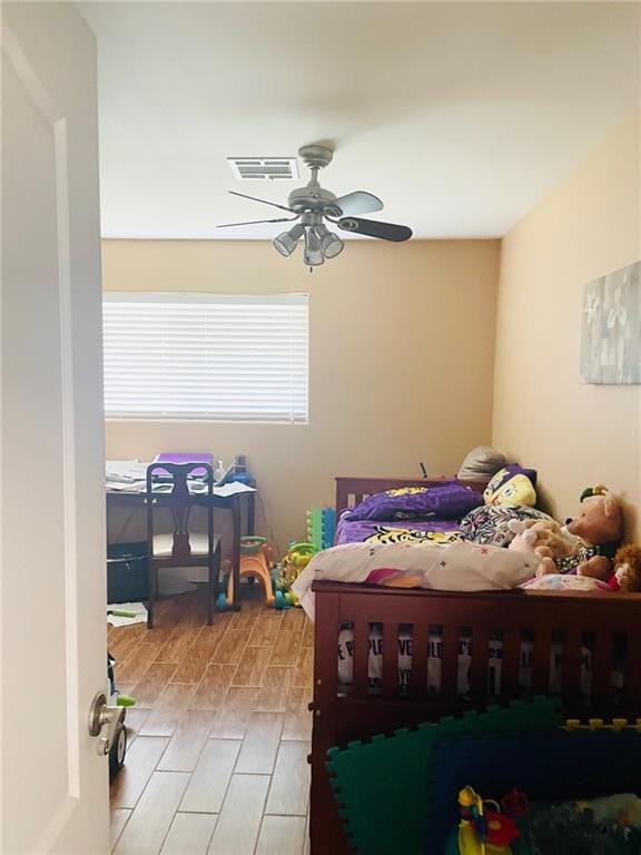 bedroom featuring ceiling fan and light wood-type flooring