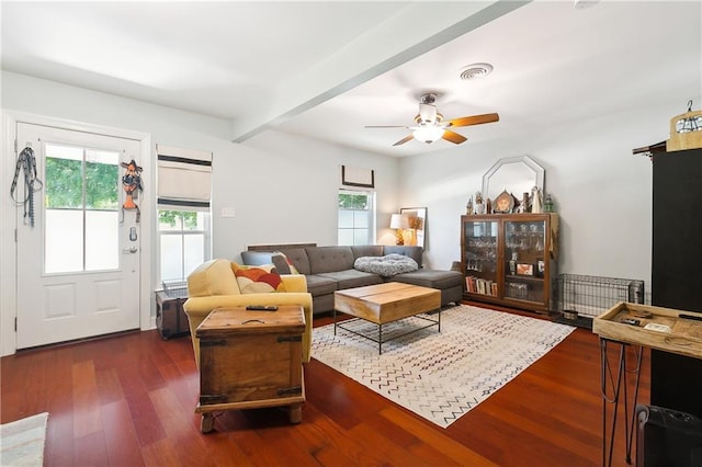 living room with beam ceiling, dark wood-type flooring, and ceiling fan