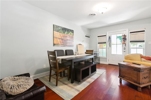 dining area featuring dark hardwood / wood-style flooring