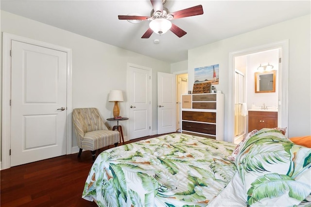 bedroom featuring ceiling fan, connected bathroom, dark hardwood / wood-style flooring, and sink