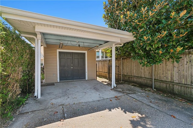 garage featuring a carport