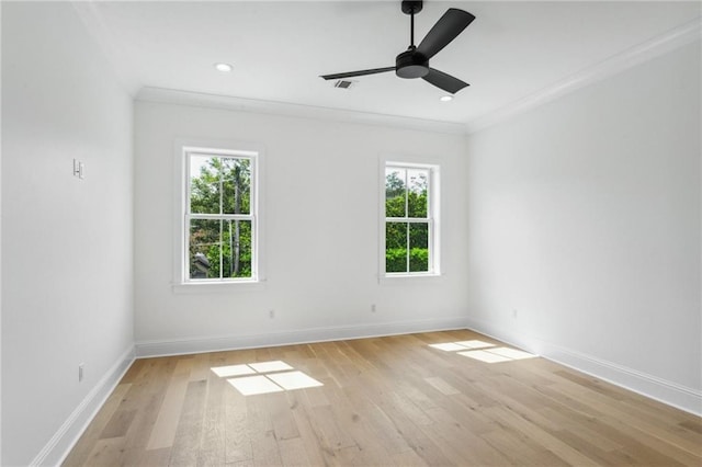 spare room with light hardwood / wood-style flooring, ornamental molding, and ceiling fan