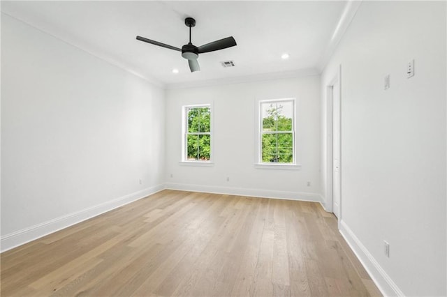 unfurnished room with crown molding, ceiling fan, and light hardwood / wood-style floors