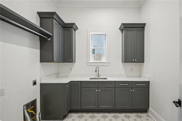 kitchen featuring sink and gray cabinetry