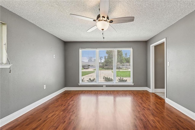 spare room featuring ceiling fan, a textured ceiling, and hardwood / wood-style flooring