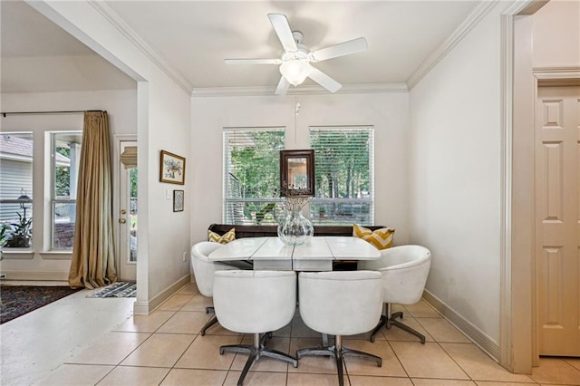 1034 Foy St, Mandeville, LA 70448 - dining room featuring light tile patterned flooring, crown molding, and baseboards