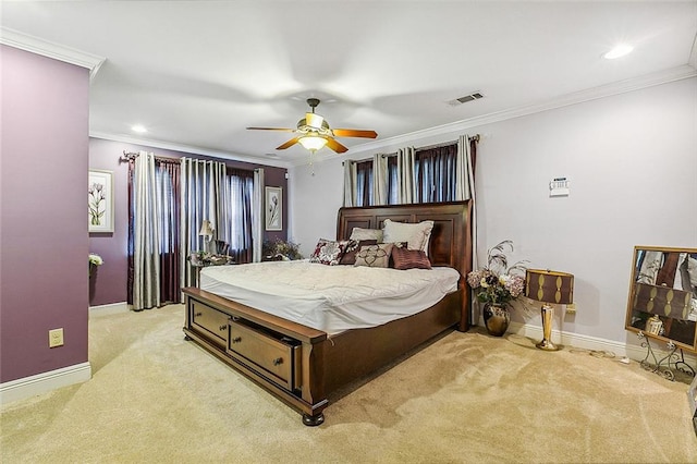 carpeted bedroom featuring ornamental molding and ceiling fan