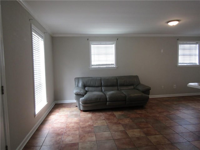 living room featuring ornamental molding, a healthy amount of sunlight, and tile patterned flooring