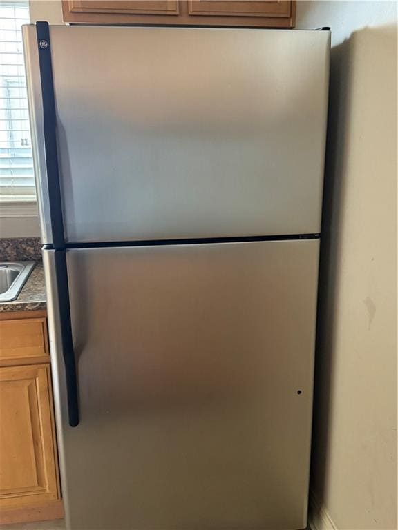 room details featuring stainless steel fridge