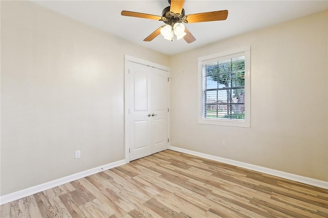 empty room featuring light hardwood / wood-style flooring and ceiling fan