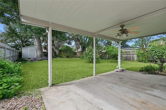 view of patio with ceiling fan and a storage shed