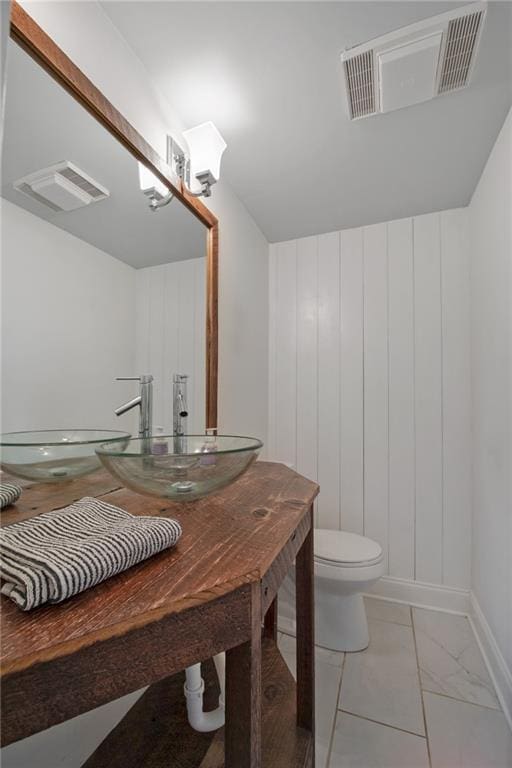 bathroom with toilet and vanity