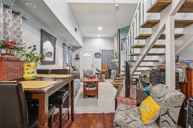 interior space with stairway, recessed lighting, and wood finished floors