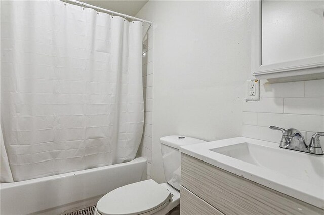 full bathroom featuring shower / bath combo, vanity, toilet, and tasteful backsplash