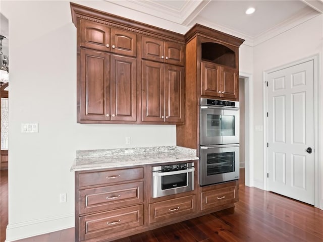 kitchen with double oven, dark hardwood / wood-style floors, and crown molding