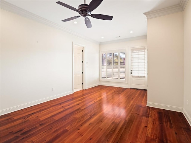 spare room featuring ceiling fan, hardwood / wood-style flooring, and crown molding