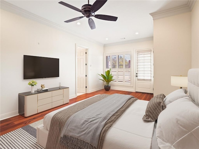 bedroom featuring crown molding, hardwood / wood-style floors, and ceiling fan