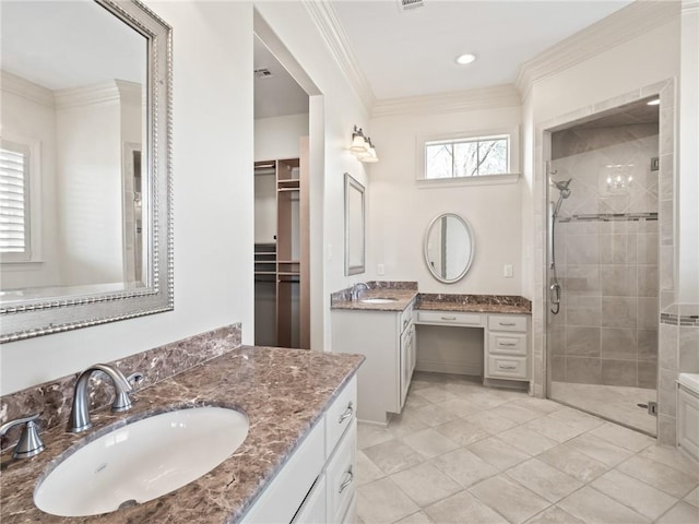 bathroom featuring dual vanity, an enclosed shower, tile patterned flooring, and crown molding