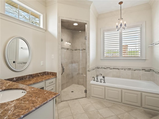 bathroom featuring crown molding, shower with separate bathtub, tile patterned floors, an inviting chandelier, and vanity