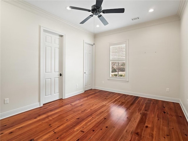 unfurnished bedroom featuring ceiling fan, wood-type flooring, and crown molding