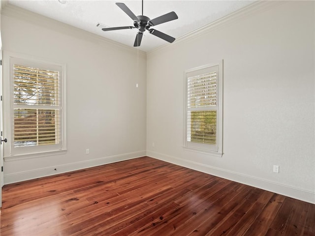 spare room with ceiling fan, wood-type flooring, ornamental molding, and a wealth of natural light