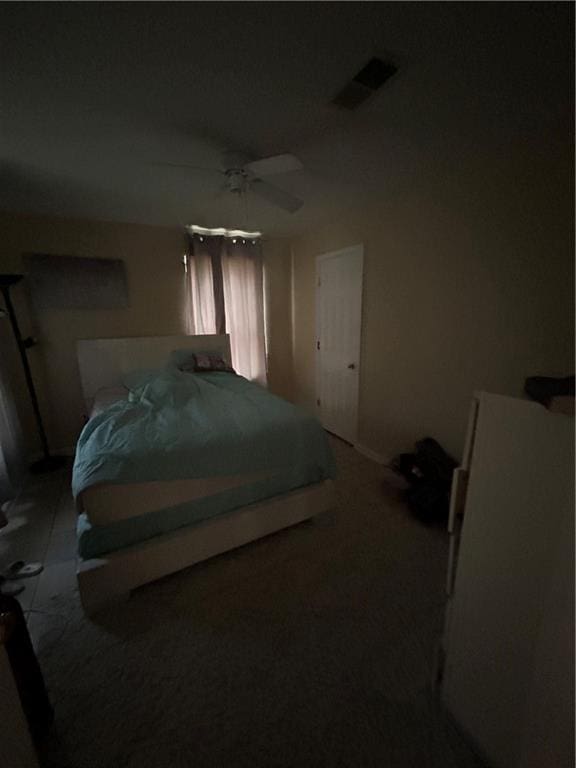 bedroom with ceiling fan and carpet