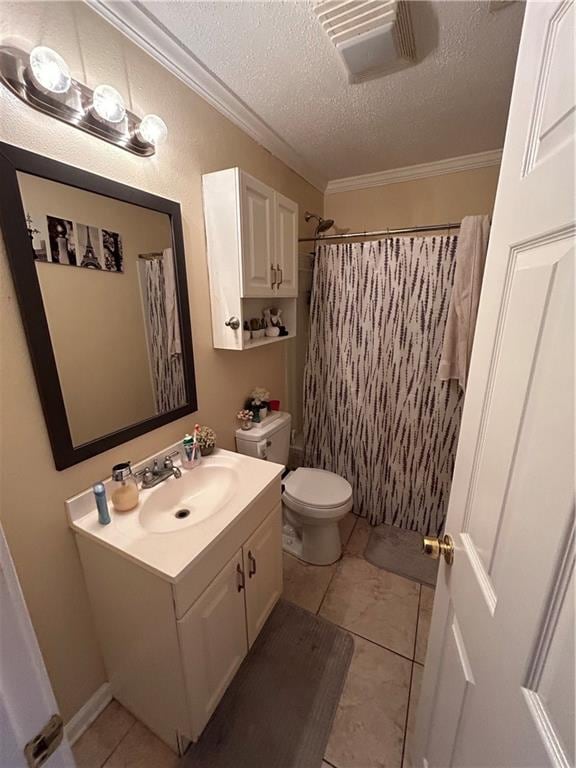 bathroom with a textured ceiling, toilet, tile patterned floors, and vanity