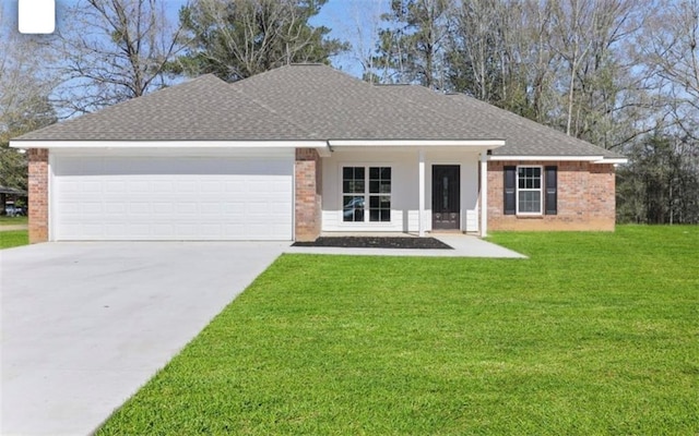 single story home with a front yard and a garage